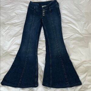 Free People dark wash stretchy 70’s style bell bottoms high rise flare buttonfly